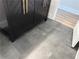 Contemporary bathroom featuring dark vanity with gold hardware and gray tile flooring at 1937 Don Juan Ln, Decatur, GA 30032