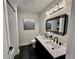 Modern bathroom with double sinks, sleek black fixtures, and stylish lighting, offering a contemporary design at 1937 Don Juan Ln, Decatur, GA 30032