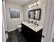 Modern bathroom showcasing a double sink vanity and stylish decorative mirror at 1937 Don Juan Ln, Decatur, GA 30032