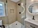 Elegant bathroom featuring a glass shower with niche and modern lighting mirror at 1937 Don Juan Ln, Decatur, GA 30032