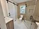 Modern bathroom with a white barn door, glass shower, and stylish vanity at 1937 Don Juan Ln, Decatur, GA 30032
