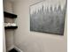 Bathroom area displaying floating shelves, rolled towels, and contemporary artwork at 1937 Don Juan Ln, Decatur, GA 30032
