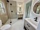 Elegant bathroom featuring a glass shower, dual sinks, and modern lighting at 1937 Don Juan Ln, Decatur, GA 30032