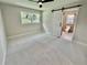 Bedroom with an ensuite bathroom and a black ceiling fan at 1937 Don Juan Ln, Decatur, GA 30032