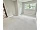 Cozy bedroom with fresh carpeting, closet, and window overlooking lush green trees at 1937 Don Juan Ln, Decatur, GA 30032