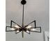 Contemporary black and gold chandelier with unique geometric design at 1937 Don Juan Ln, Decatur, GA 30032