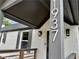 Close-up of the home's address showcasing freshly painted brick, modern exterior lighting, and gray trim at 1937 Don Juan Ln, Decatur, GA 30032