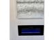 Close-up of the modern electric fireplace with a textured decorative wall panel at 1937 Don Juan Ln, Decatur, GA 30032
