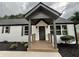 Inviting renovated house featuring a covered front porch and white painted brick at 1937 Don Juan Ln, Decatur, GA 30032