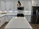 Bright kitchen showcasing a marble countertop island and stainless steel appliances at 1937 Don Juan Ln, Decatur, GA 30032
