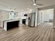 Modern kitchen with white cabinets, stainless steel appliances, and stylish pendant lighting at 1937 Don Juan Ln, Decatur, GA 30032