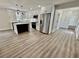Modern kitchen features stainless steel appliances, white cabinets, and an island with a waterfall countertop at 1937 Don Juan Ln, Decatur, GA 30032