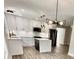 Modern kitchen boasts white cabinets, stainless steel appliances, and stylish island at 1937 Don Juan Ln, Decatur, GA 30032