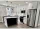 New kitchen features white cabinets, modern lighting, and stainless steel appliances at 1937 Don Juan Ln, Decatur, GA 30032