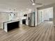 Modern kitchen featuring stainless steel appliances, island, white cabinetry, designer backsplash, and attractive flooring at 1937 Don Juan Ln, Decatur, GA 30032