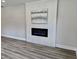 Modern living room featuring a built-in electric fireplace and sleek flooring at 1937 Don Juan Ln, Decatur, GA 30032