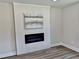 Modern living room featuring a built-in electric fireplace and sleek flooring at 1937 Don Juan Ln, Decatur, GA 30032