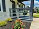 Charming front porch featuring modern gray railings, fresh landscaping, and a freshly painted white brick exterior at 1937 Don Juan Ln, Decatur, GA 30032