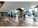 Well-equipped gym with treadmills, bikes, and large windows for natural light and view at 400 W Peachtree Nw St # 3216, Atlanta, GA 30308