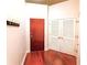 Entryway showcasing hardwood floors, coat hooks, and storage solutions at 400 W Peachtree Nw St # 3216, Atlanta, GA 30308