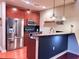 Modern kitchen with stainless steel appliances, granite countertops, and stylish pendant lighting at 400 W Peachtree Nw St # 3216, Atlanta, GA 30308