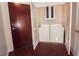 Efficient laundry room with a stacked washer and dryer and cabinet storage space at 400 W Peachtree Nw St # 3216, Atlanta, GA 30308