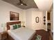 Modern main bedroom featuring a platform bed, ceiling fan, and access to an en-suite bathroom at 400 W Peachtree Nw St # 3216, Atlanta, GA 30308