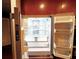 Interior view of the Frigidaire Professional refrigerator showing ample storage and adjustable shelves at 400 W Peachtree Nw St # 3216, Atlanta, GA 30308