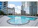 Outdoor swimming pool surrounded by lounge chairs and high-rise buildings at 400 W Peachtree Nw St # 3216, Atlanta, GA 30308