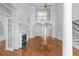 Bright and spacious living room with fireplace, hardwood floors, and second story view at 5070 Riverlake Dr, Peachtree Corners, GA 30097