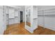 Large walk-in closet with white shelving and drawers, plus a full-length mirror at 5070 Riverlake Dr, Peachtree Corners, GA 30097