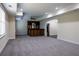 Finished basement with plush carpeting, bar area, and ample space for entertaining at 610 Big Bend Trail, Sugar Hill, GA 30518