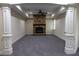 Cozy basement with stone fireplace, plush carpeting, and classic trim at 610 Big Bend Trail, Sugar Hill, GA 30518