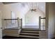 Bright bedroom featuring hardwood floors, a vaulted ceiling, and large windows at 610 Big Bend Trail, Sugar Hill, GA 30518