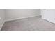 An airy bedroom featuring plush gray carpeting and a light-filled ambiance at 1528 Wembley Dr, Douglasville, GA 30134