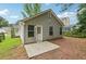 Exterior view of the rear of a house complete with vinyl siding and concrete patio at 1528 Wembley Dr, Douglasville, GA 30134