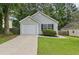 Cozy single-story home with a one-car garage, tidy landscaping, and inviting curb appeal at 1528 Wembley Dr, Douglasville, GA 30134