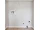 Picture of a functional laundry room area complete with tile floors and washer/dryer hookups at 1528 Wembley Dr, Douglasville, GA 30134
