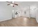 Open concept living area with new floors, ceiling fan, and seamless flow into the kitchen at 1528 Wembley Dr, Douglasville, GA 30134