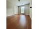 Neutral bedroom with hardwood floors, a window, and a closet door at 2913 Jordan Forest Trl, Lawrenceville, GA 30044