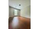 Bright bedroom with hardwood floors and a window overlooking the yard at 2913 Jordan Forest Trl, Lawrenceville, GA 30044