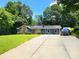 Charming single-story home boasts a welcoming facade and a long driveway at 2913 Jordan Forest Trl, Lawrenceville, GA 30044