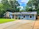 Charming home with a stone facade and solar panels, set back from the road with a spacious driveway at 2913 Jordan Forest Trl, Lawrenceville, GA 30044