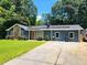 This inviting house boasts energy-efficient solar panels and a lush green lawn, perfect for modern living at 2913 Jordan Forest Trl, Lawrenceville, GA 30044