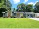Charming home with stone accents and well-manicured lawn, creating a welcoming curb appeal at 2913 Jordan Forest Trl, Lawrenceville, GA 30044