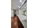 Hallway with hardwood floors and white walls at 2913 Jordan Forest Trl, Lawrenceville, GA 30044