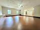 Large living room with ceiling fan, hardwood floors, and natural light at 2913 Jordan Forest Trl, Lawrenceville, GA 30044