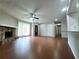 Spacious living room with hardwood floors, stone fireplace, and natural light at 2913 Jordan Forest Trl, Lawrenceville, GA 30044
