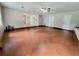 Spacious living room with hardwood floors, large windows, and neutral walls provide a bright, airy space at 2913 Jordan Forest Trl, Lawrenceville, GA 30044
