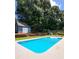 Enjoy the outdoors with this sparkling pool and charming storage shed, adding functionality to the backyard at 2913 Jordan Forest Trl, Lawrenceville, GA 30044